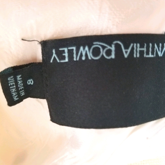 Sleeveless creme-colored dress with back detail - Picture 2 of 5